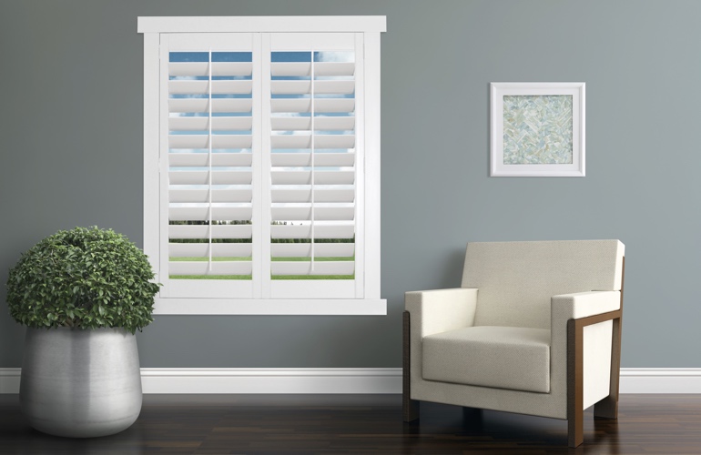 Contemporary room with white plantation shutters